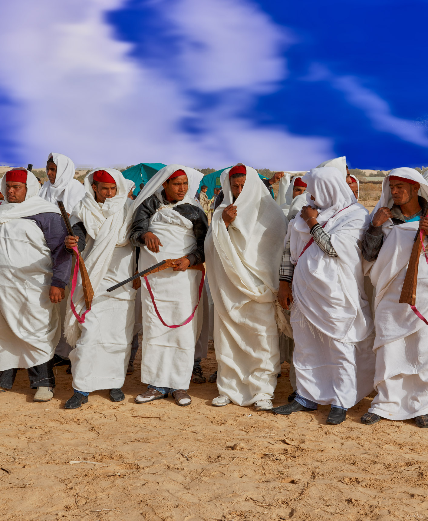 Entre hommes - figurative wall art featuring Figurative artwork of a line of men in white traditional dress gathered under a brilliant blue sky